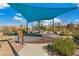 Circular playground with a basket swing and shade structure at 2571 Hazelburn Ave, Henderson, NV 89044