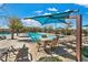 Community pool with lounge chairs and shade umbrellas at 2571 Hazelburn Ave, Henderson, NV 89044