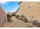 Side yard with gravel landscaping and AC units at 2571 Hazelburn Ave, Henderson, NV 89044