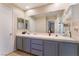 Bathroom with double vanity and light blue cabinets at 2789 Trotwood Ln, Las Vegas, NV 89108