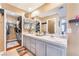 Double vanity bathroom with a walk-in closet at 2789 Trotwood Ln, Las Vegas, NV 89108