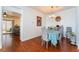 Bright dining room features hardwood floors and a charming table setting at 2789 Trotwood Ln, Las Vegas, NV 89108