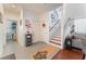 Bright entryway with stairs, coat closet, and wood flooring at 2789 Trotwood Ln, Las Vegas, NV 89108