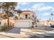 Two-story house with balcony, two-car garage, and mature trees at 2789 Trotwood Ln, Las Vegas, NV 89108