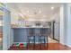 Modern kitchen with stainless steel appliances and a breakfast bar at 2789 Trotwood Ln, Las Vegas, NV 89108