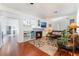 Open living room showcasing hardwood floors, a fireplace, and a lofted area at 2789 Trotwood Ln, Las Vegas, NV 89108