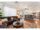 Living room with hardwood floors, comfortable seating, and kitchen views at 2789 Trotwood Ln, Las Vegas, NV 89108