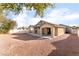 Large backyard with gravel and covered patio at 3008 Blush Noisette Ave, North Las Vegas, NV 89081