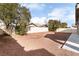 Large backyard with gravel and trees at 3008 Blush Noisette Ave, North Las Vegas, NV 89081