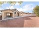 Large backyard with gravel and covered patio at 3008 Blush Noisette Ave, North Las Vegas, NV 89081