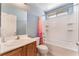 Clean bathroom, featuring a tub shower and wood vanity at 3008 Blush Noisette Ave, North Las Vegas, NV 89081