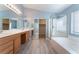 Bathroom with double vanity, shower, and large walk-in closet at 3008 Blush Noisette Ave, North Las Vegas, NV 89081