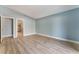 Light and airy bedroom with neutral walls and wood-look flooring at 3008 Blush Noisette Ave, North Las Vegas, NV 89081