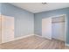 Well-lit bedroom with neutral walls and ample closet space at 3008 Blush Noisette Ave, North Las Vegas, NV 89081