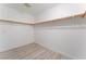 Large walk-in closet with double rods and light gray floors at 3008 Blush Noisette Ave, North Las Vegas, NV 89081