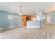 Open kitchen with island and light wood cabinets at 3008 Blush Noisette Ave, North Las Vegas, NV 89081