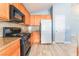 Kitchen with granite countertops and wood cabinets at 3008 Blush Noisette Ave, North Las Vegas, NV 89081