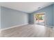 Bright living room with light gray floors and access to backyard at 3008 Blush Noisette Ave, North Las Vegas, NV 89081