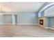 Living area with fireplace and wood-look floors at 3008 Blush Noisette Ave, North Las Vegas, NV 89081