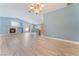 Living room with vaulted ceiling, fireplace and kitchen view at 3008 Blush Noisette Ave, North Las Vegas, NV 89081