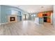 Light-filled living room with fireplace and wood-look floors at 3008 Blush Noisette Ave, North Las Vegas, NV 89081