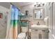 Clean bathroom with a shower/tub combo and vanity at 309 Wisteria Ave, Las Vegas, NV 89107