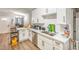 Modern kitchen with white cabinets and stainless steel appliances at 309 Wisteria Ave, Las Vegas, NV 89107