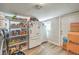 Well-stocked pantry with ample shelving and refrigerator at 309 Wisteria Ave, Las Vegas, NV 89107