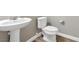 Simple bathroom with pedestal sink and toilet at 315 Rhiannon Ct, Las Vegas, NV 89183