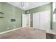 Bedroom with green walls and double door closet at 315 Rhiannon Ct, Las Vegas, NV 89183