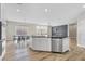 Modern kitchen with large island, stainless steel appliances and hardwood floors at 315 Rhiannon Ct, Las Vegas, NV 89183