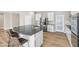 Modern kitchen island with seating and stainless steel appliances at 315 Rhiannon Ct, Las Vegas, NV 89183