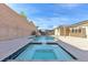 Relaxing backyard with large pool, spa, and waterfall feature at 315 Rhiannon Ct, Las Vegas, NV 89183