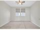 Spacious bedroom with neutral carpeting and two windows at 3494 Brezine Ave, Henderson, NV 89044