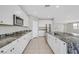 Modern kitchen with white cabinets and granite countertops at 3494 Brezine Ave, Henderson, NV 89044