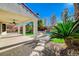 Landscaped backyard with a pool and patio area at 3733 Via Di Girolamo Ave, Henderson, NV 89052