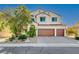 Two-story house with a three-car garage and attractive landscaping at 3733 Via Di Girolamo Ave, Henderson, NV 89052