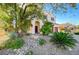 Landscaped front yard with mature trees and drought-tolerant plants at 3733 Via Di Girolamo Ave, Henderson, NV 89052