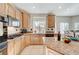 Modern kitchen with granite countertops and island at 3733 Via Di Girolamo Ave, Henderson, NV 89052