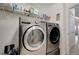 Laundry room with washer, dryer, and shelving at 3733 Via Di Girolamo Ave, Henderson, NV 89052