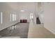 Two-story living room with high ceilings, tile and carpet floors at 3733 Via Di Girolamo Ave, Henderson, NV 89052