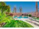 Inviting pool with waterfall feature and lounge chairs at 3733 Via Di Girolamo Ave, Henderson, NV 89052