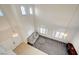 High-ceiling view of staircase and living room at 3733 Via Di Girolamo Ave, Henderson, NV 89052