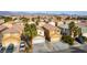 Aerial view of two story house with neighborhood in background at 4150 Pohickery Ct, Las Vegas, NV 89115