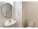 Clean bathroom with pedestal sink and toilet at 4150 Pohickery Ct, Las Vegas, NV 89115