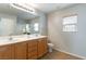 Double vanity bathroom with tiled floor and shower at 4150 Pohickery Ct, Las Vegas, NV 89115