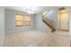 Bright dining area with tile floors and staircase at 4150 Pohickery Ct, Las Vegas, NV 89115