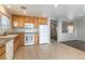 Bright kitchen features granite countertops and oak cabinets at 4150 Pohickery Ct, Las Vegas, NV 89115