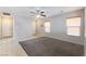 Living room features a ceiling fan and carpet at 4150 Pohickery Ct, Las Vegas, NV 89115