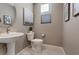 Small bathroom with pedestal sink and toilet at 4302 Swift St, Las Vegas, NV 89135